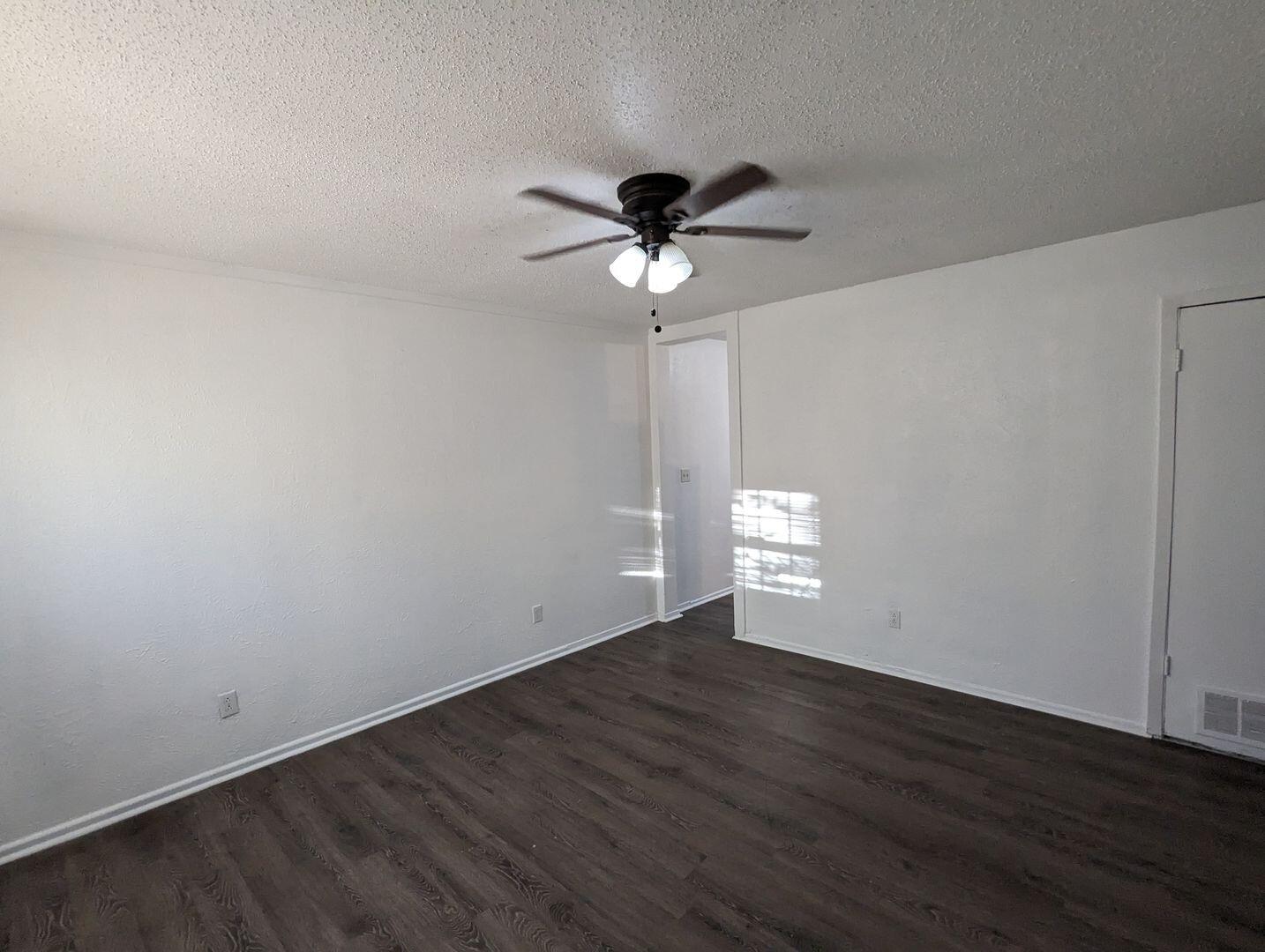 535 42nd Street, Unit A & B Lubbock, TX 79404 - Photo 3 of 13 a view of an empty room with wooden floor
