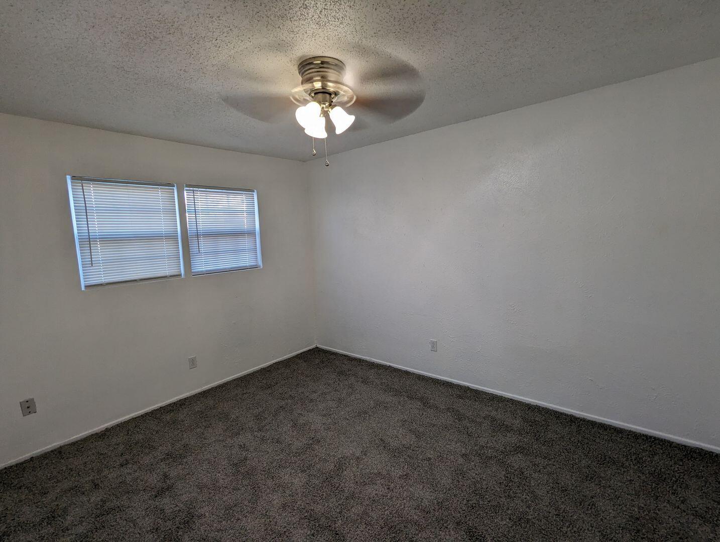 535 42nd Street, Unit A & B Lubbock, TX 79404 - Photo 8 of 13 wooden floor in an empty room with a window