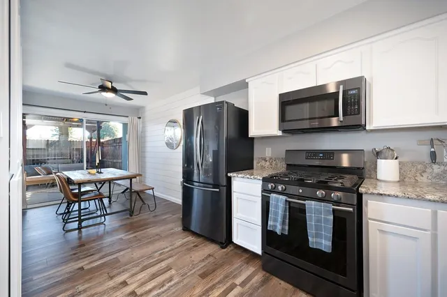 a view of living room and wooden floor