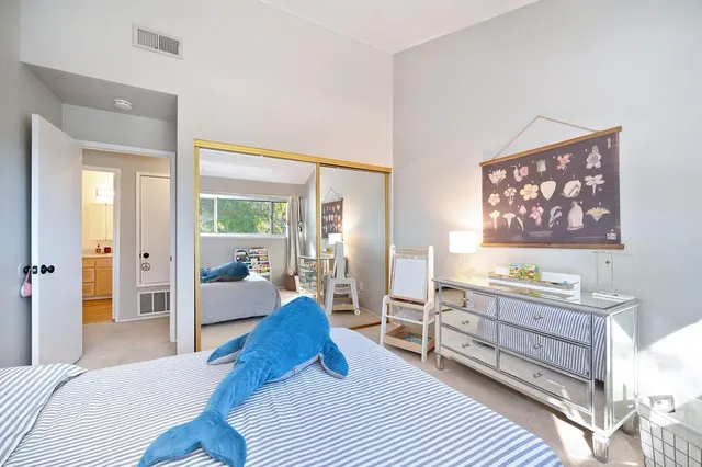 a bathroom with a sink vanity mirror and toilet