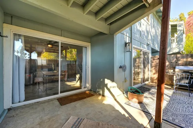 a view of a chairs and table in backyard