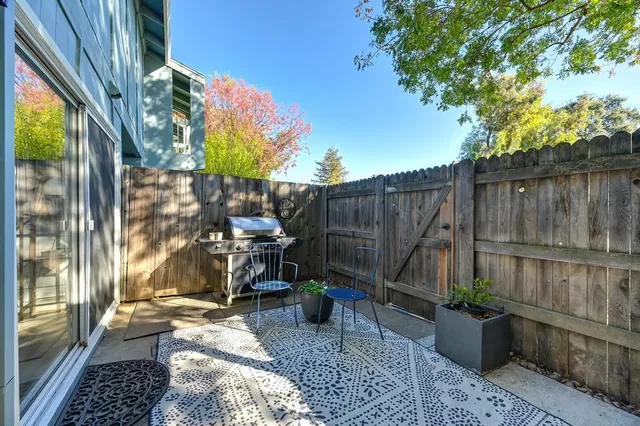 a view of a small house with garage