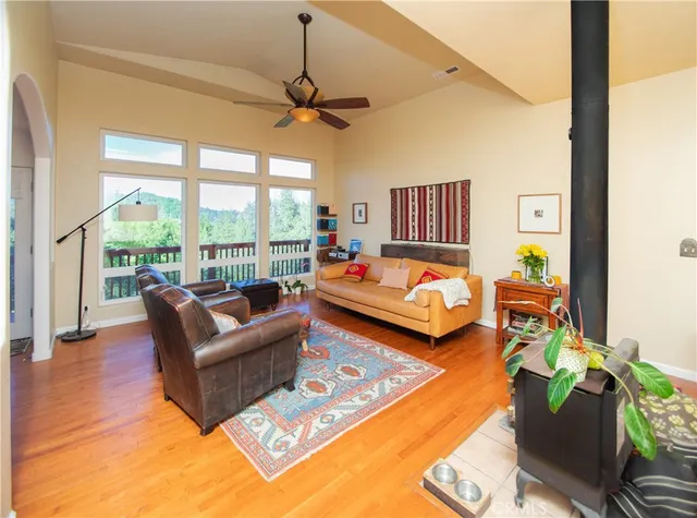 a bedroom with furniture and a large window
