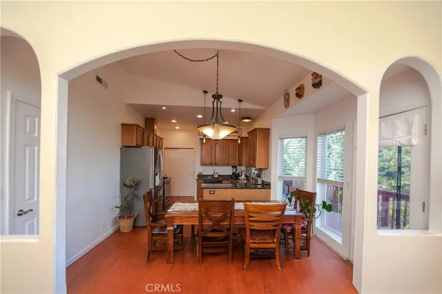 a view of a dining room with furniture window and wooden floor