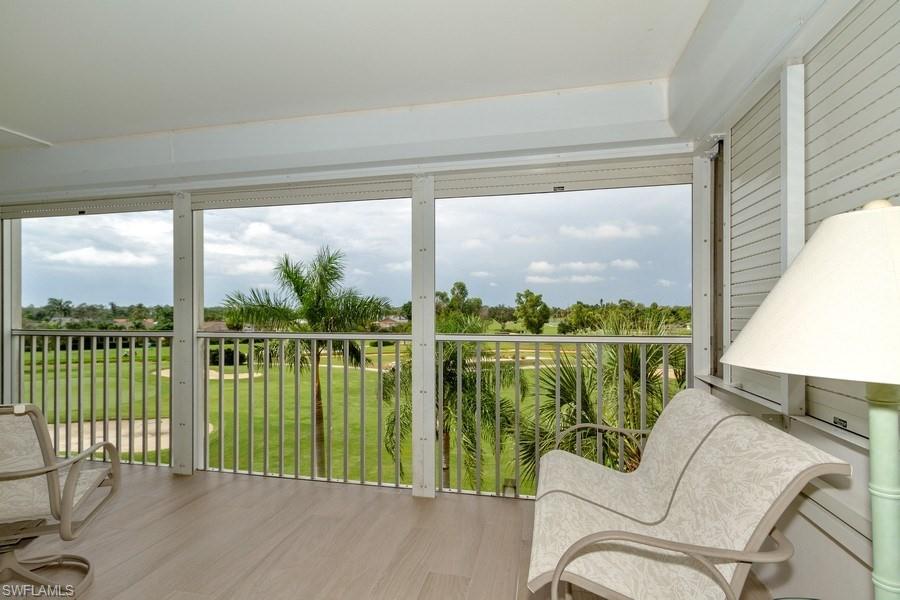 200 Pebble Beach Boulevard, Unit D402 Naples, FL 34113 - Photo 11 of 14 a balcony with furniture