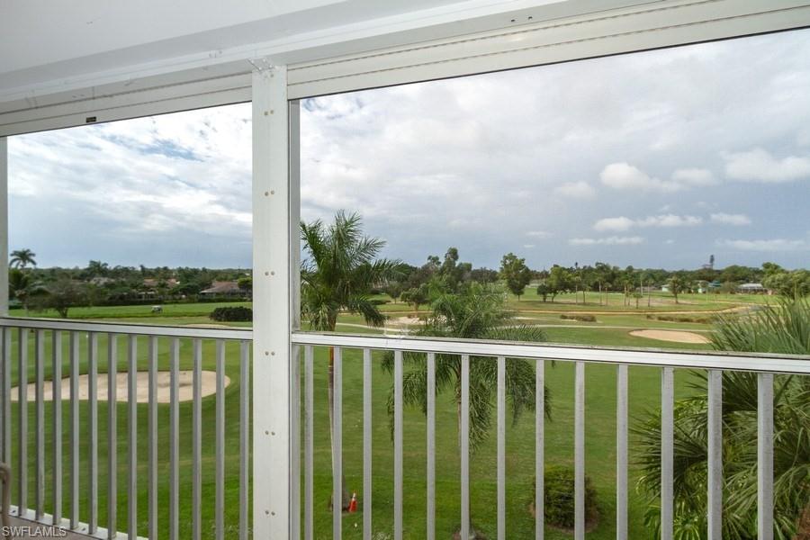 200 Pebble Beach Boulevard, Unit D402 Naples, FL 34113 - Photo 13 of 14 a view of a balcony with lake view
