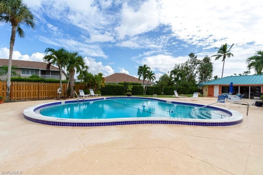 200 Pebble Beach Boulevard, Unit D402 Naples, FL 34113 - Photo 14 of 14 a view of outdoor space and yard