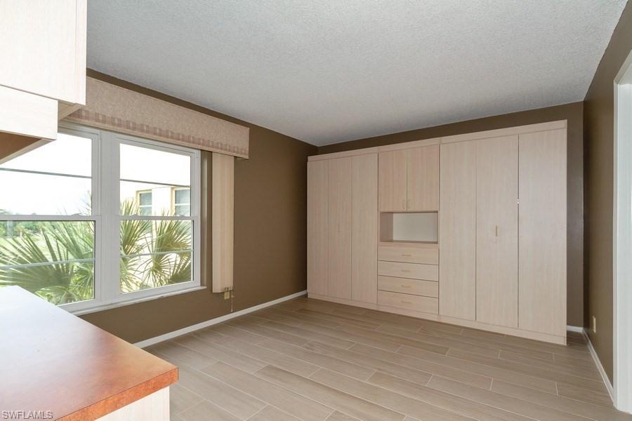 200 Pebble Beach Boulevard, Unit D402 Naples, FL 34113 - Photo 6 of 14 a view of an empty room with a window