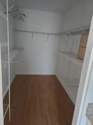 a view of a room with racks on the wall