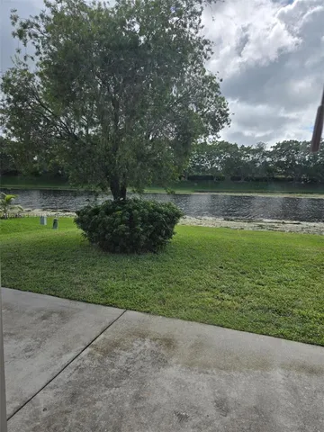 a view of a lake with a big yard