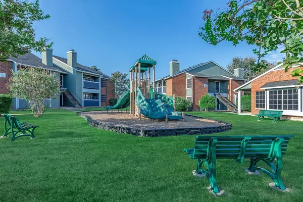 a view of a house with a yard porch and sitting area