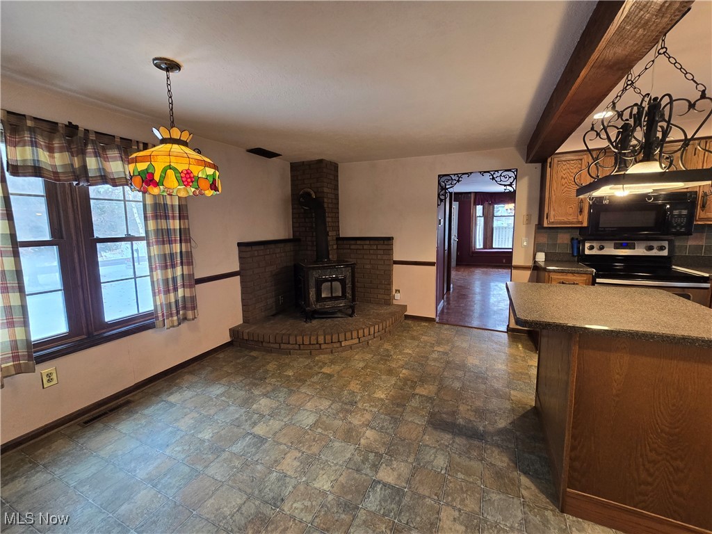 4300 Poe Road Medina, OH 44256 - Photo 14 of 45 Eat in Kitchen featuring a wood burning stove