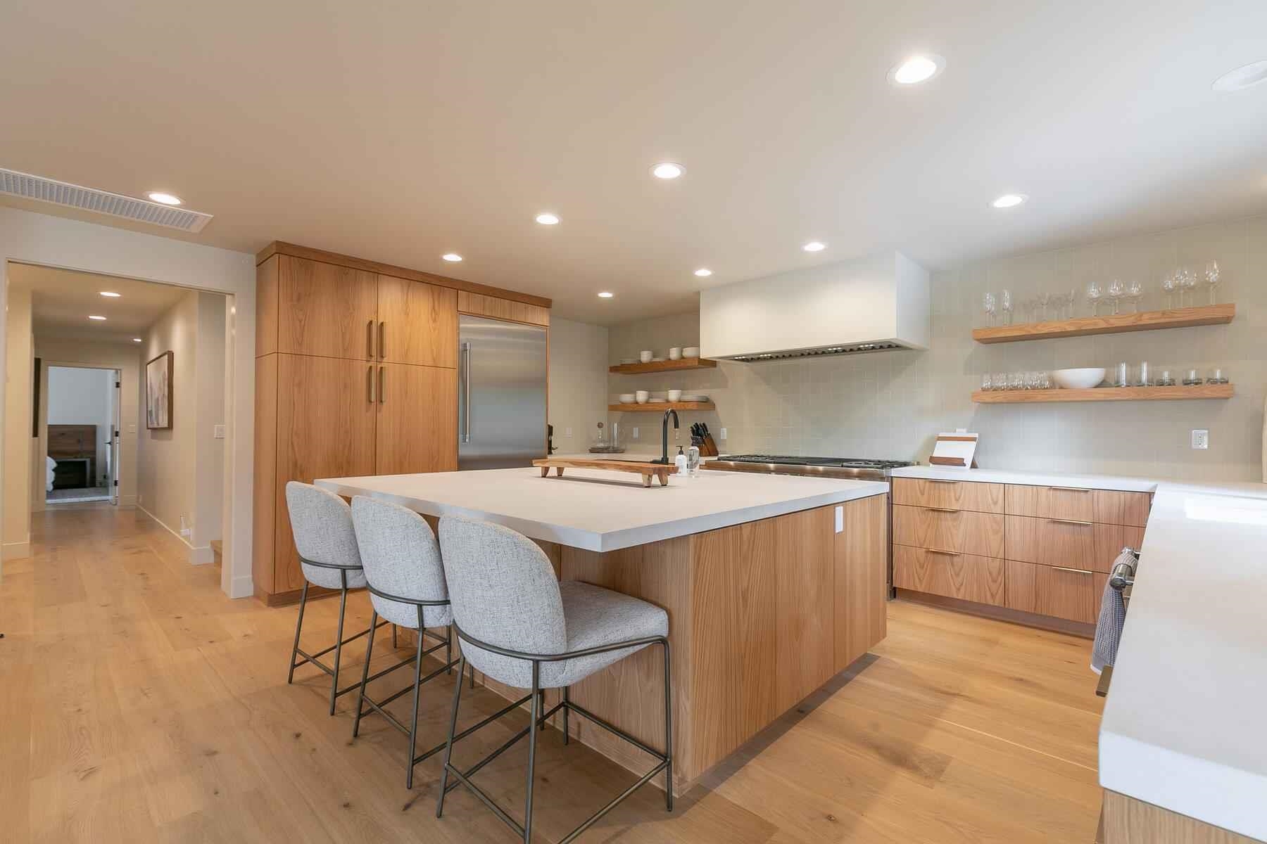 237 Basque Drive Truckee, CA 96161 - Photo 15 of 23 a large kitchen with kitchen island a sink table and chairs