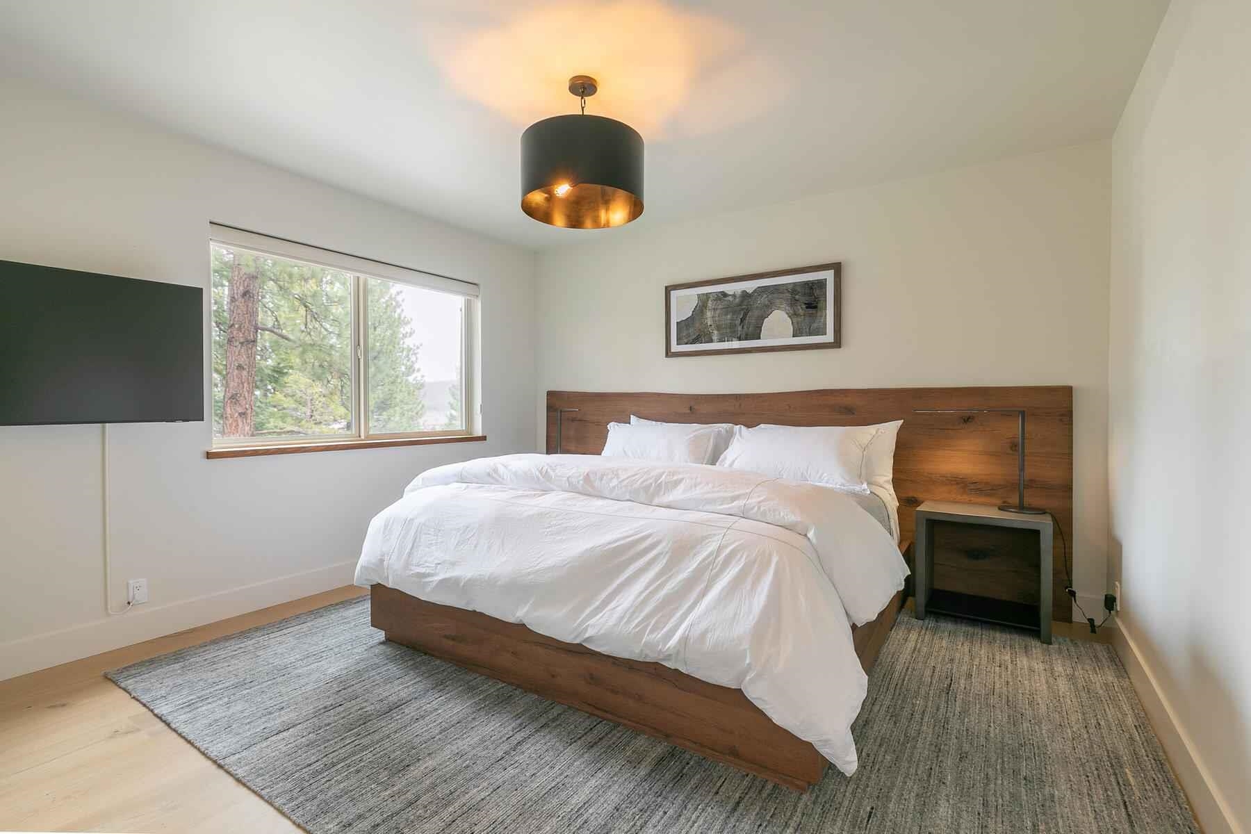 237 Basque Drive Truckee, CA 96161 - Photo 16 of 23 a bedroom with a bed and a window