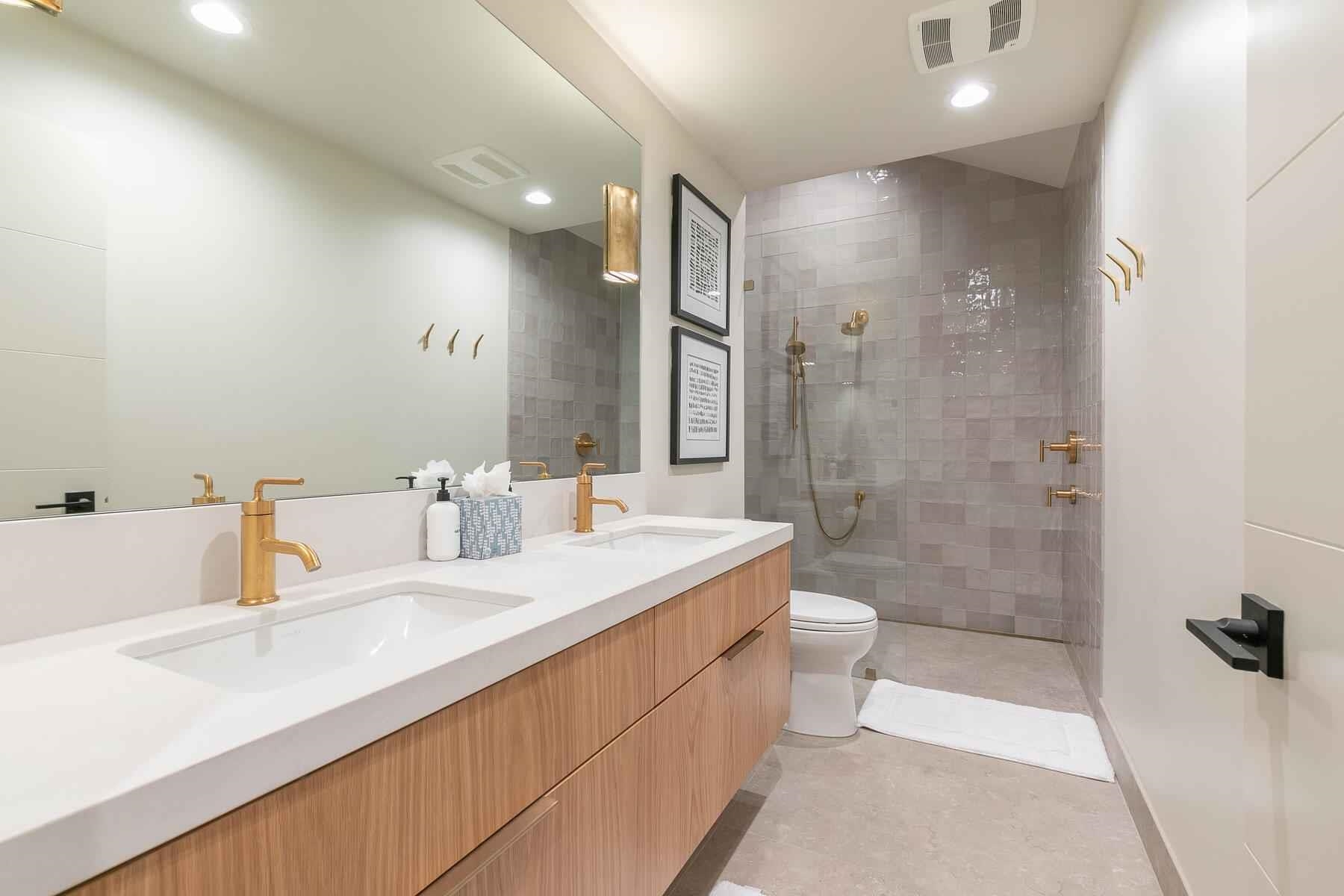 237 Basque Drive Truckee, CA 96161 - Photo 22 of 23 a bathroom with a double vanity sink toilet and shower