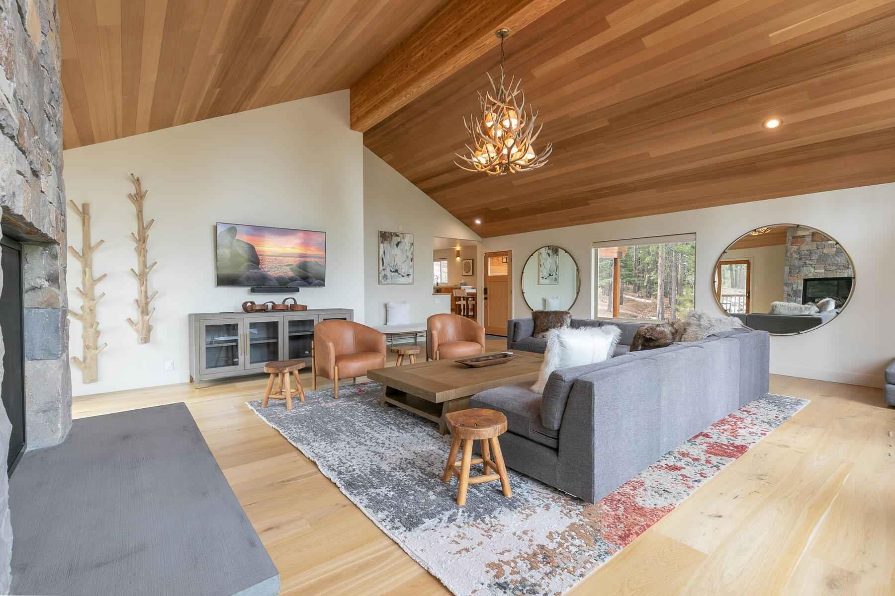 237 Basque Drive Truckee, CA 96161 - Photo 9 of 23 a living room with fireplace furniture and a flat screen tv