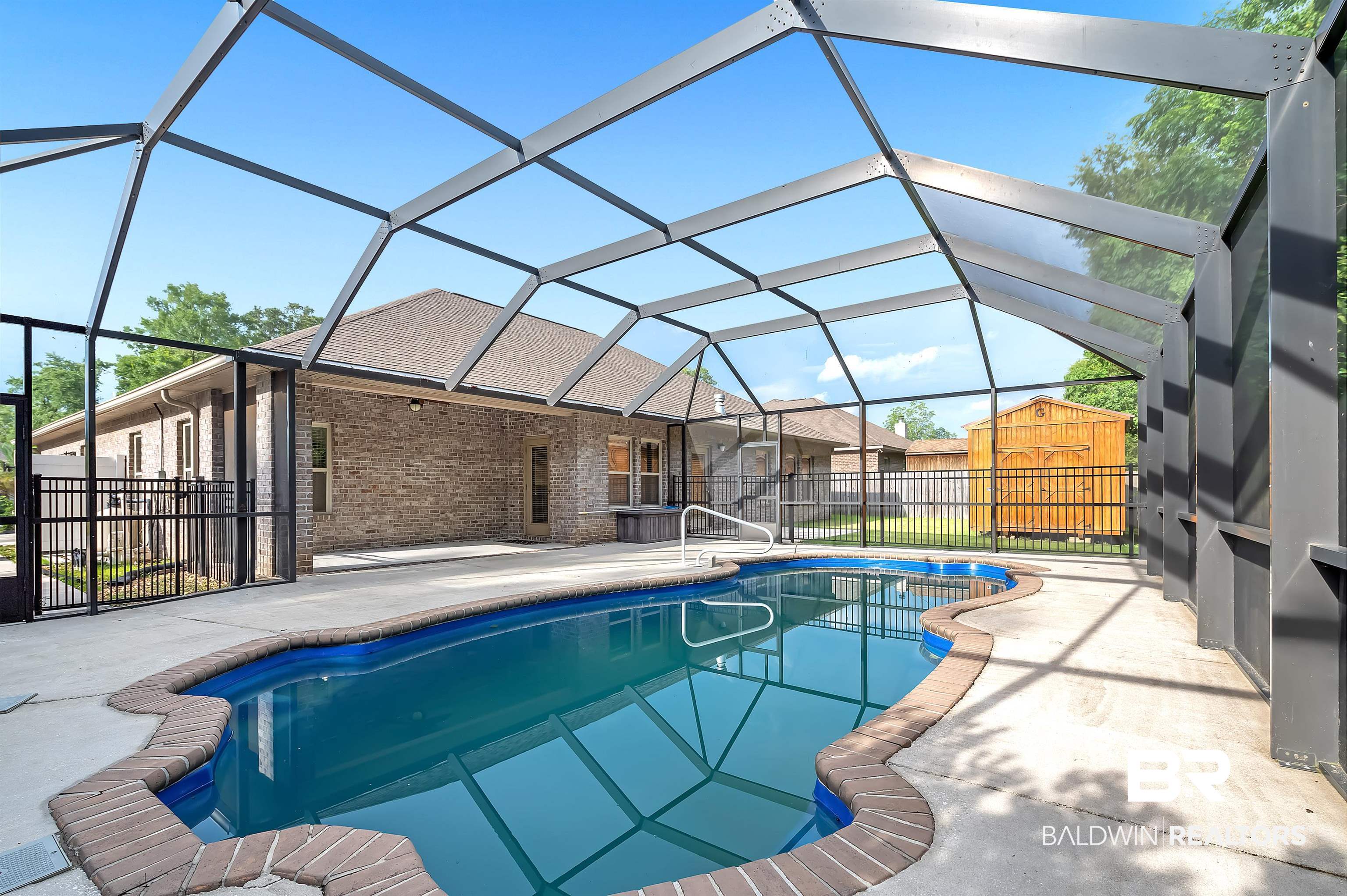 1086 Melbourne Court Foley, AL 36535 - Photo 3 of 43 View of swimming pool featuring an outdoor structure, glass enclosure, and a patio area