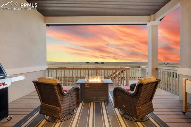 a view of a balcony with furniture