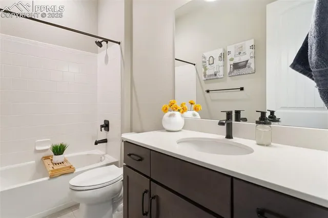 a bathroom with a sink toilet and a mirror