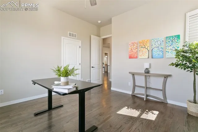 a workspace with furniture and a potted plant