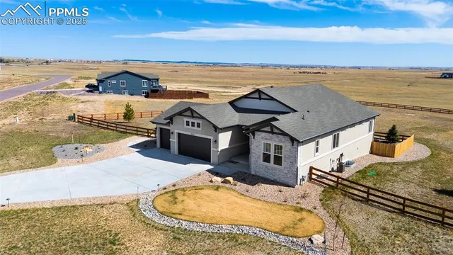 an aerial view of a house with a ocean view