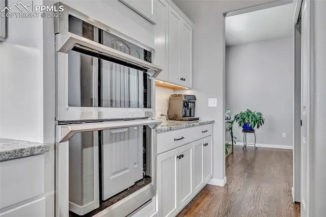 a kitchen with stainless steel appliances a white stove top oven and a refrigerator