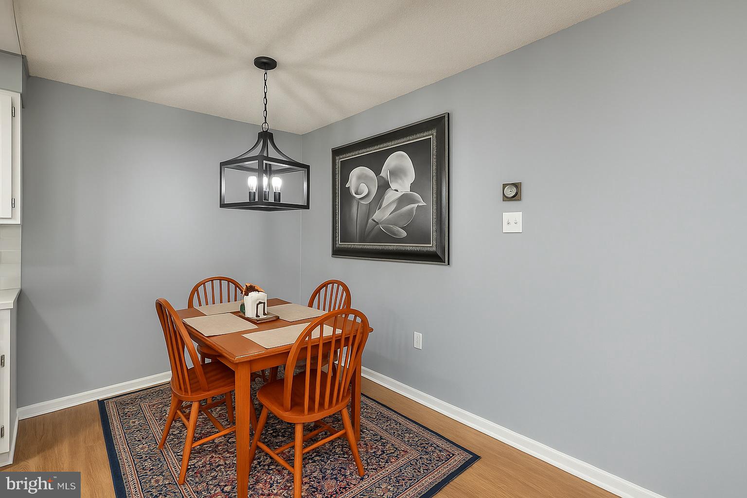 860 Lower Ferry Road, Unit 2C Ewing, NJ 08628 - Photo 12 of 19 a view of a dining room with furniture and wooden floor