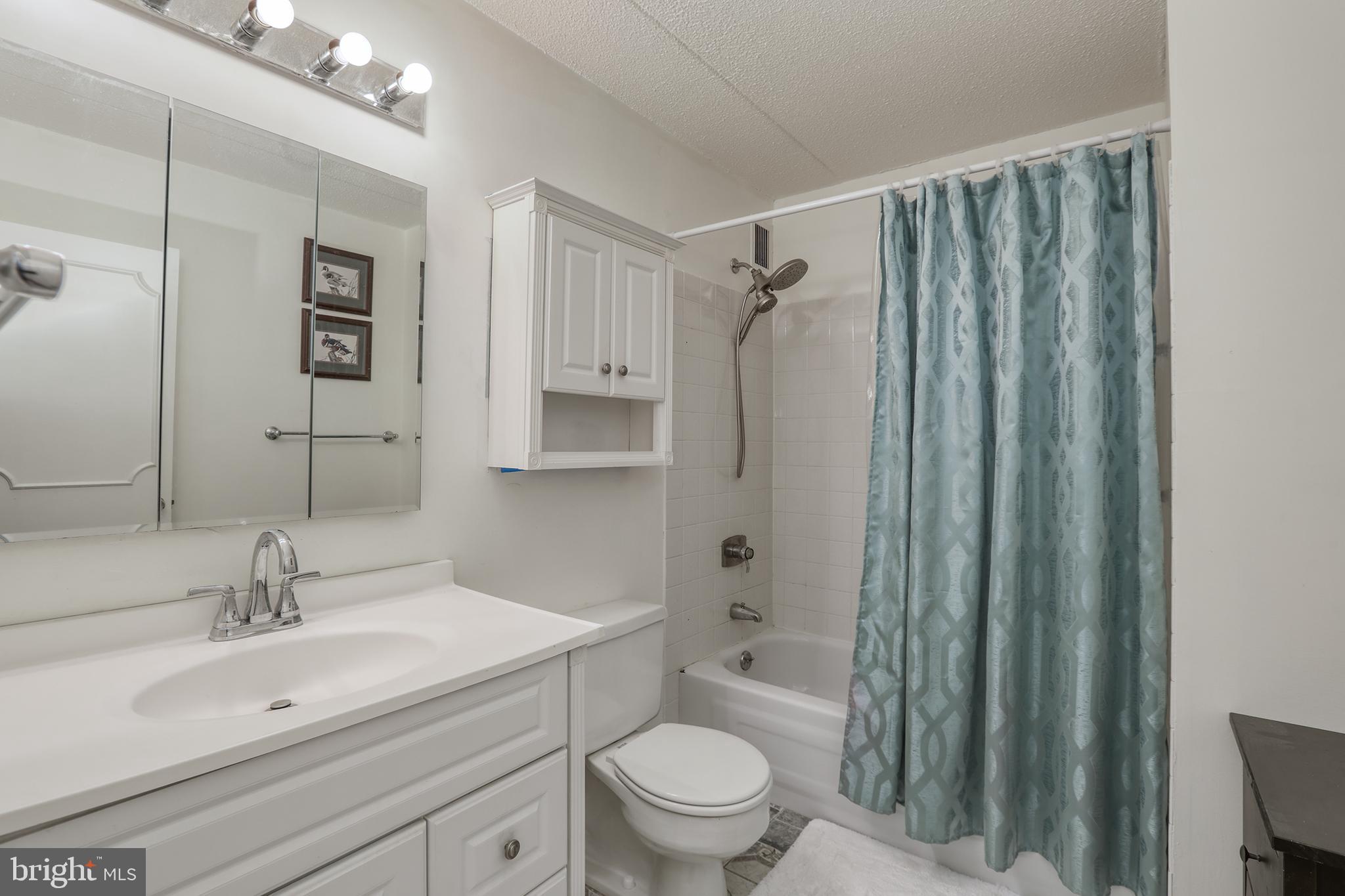 860 Lower Ferry Road, Unit 2C Ewing, NJ 08628 - Photo 13 of 19 a bathroom with a sink toilet and shower