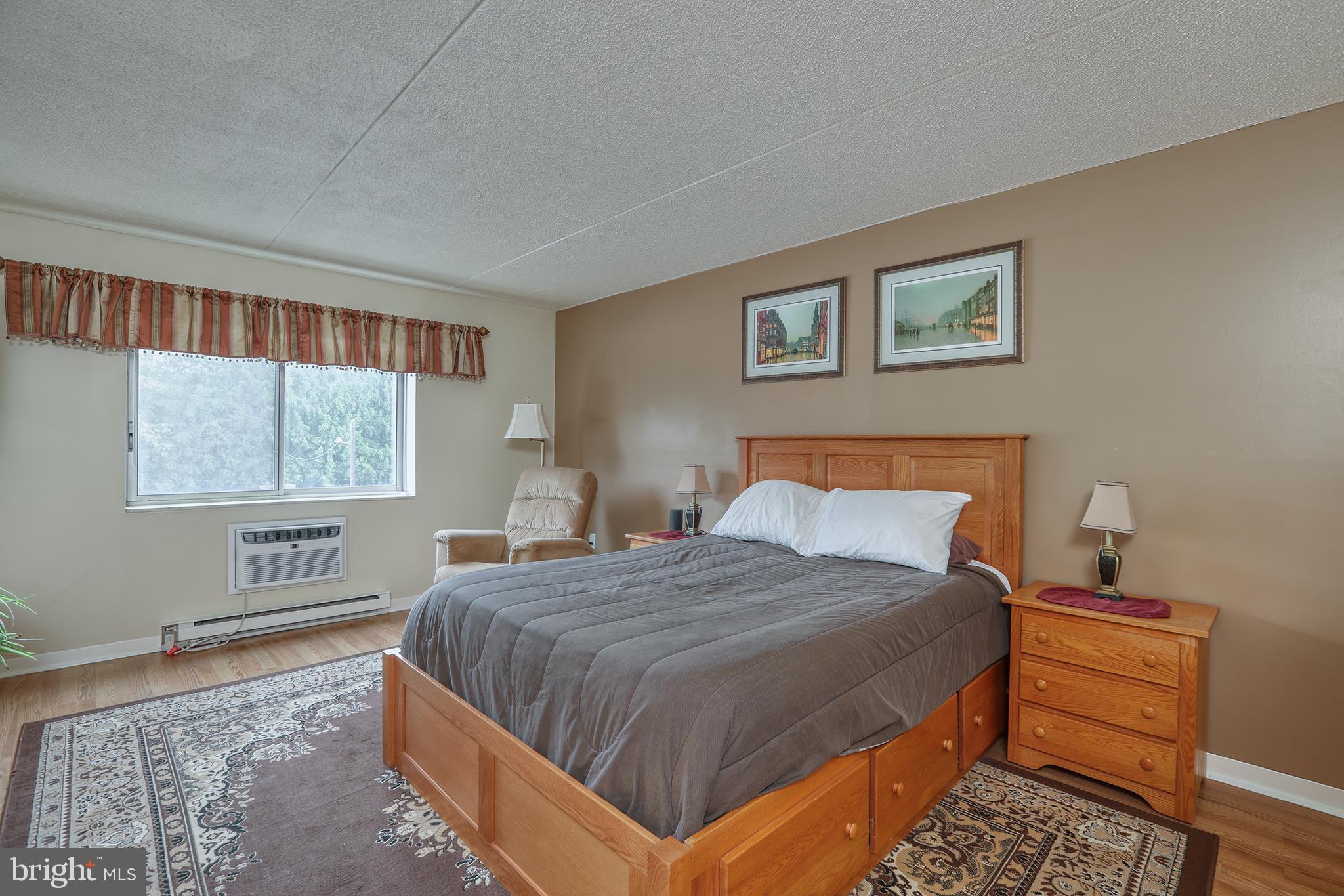 860 Lower Ferry Road, Unit 2C Ewing, NJ 08628 - Photo 15 of 19 a bedroom with a bed and window