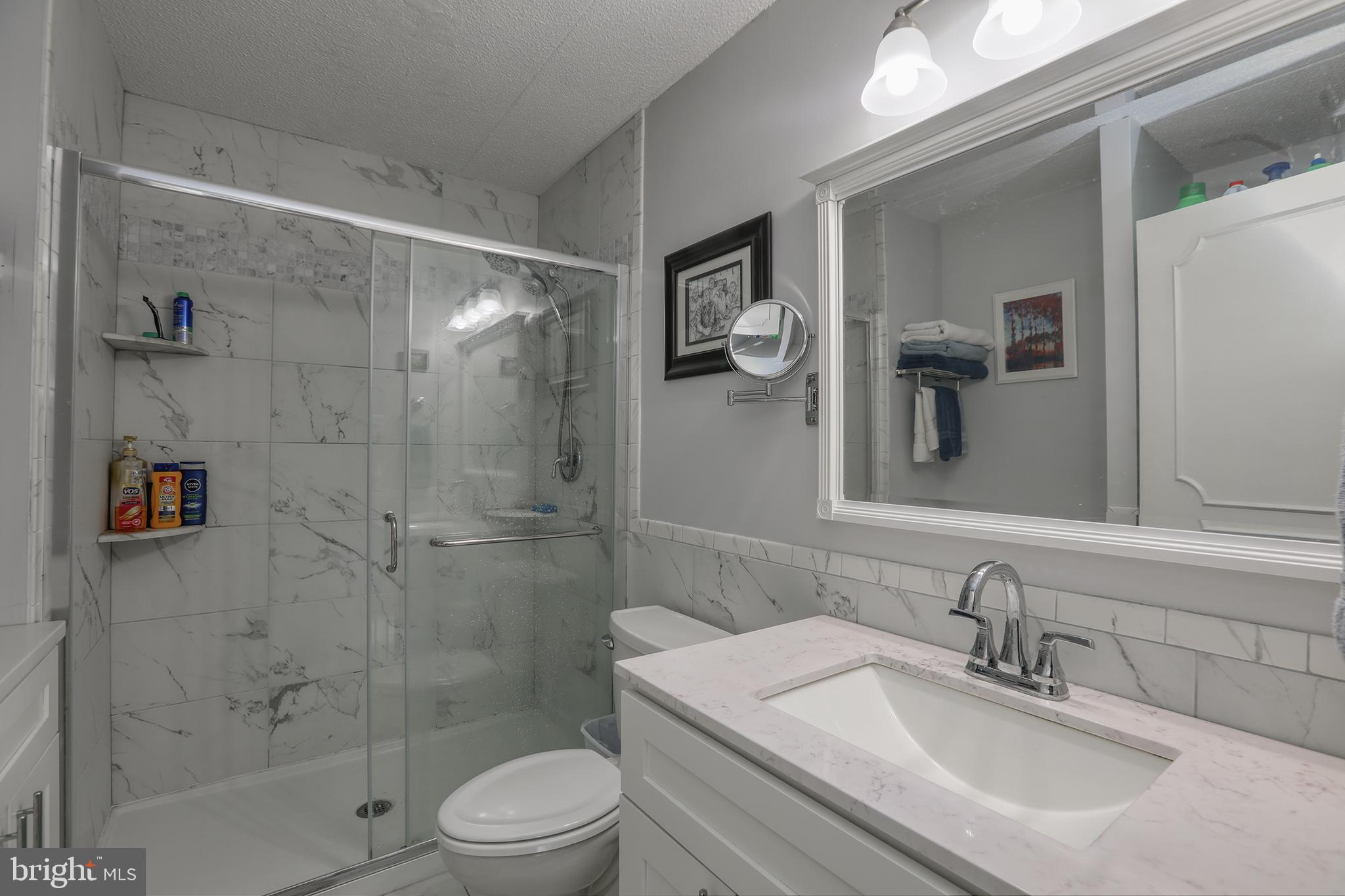 860 Lower Ferry Road, Unit 2C Ewing, NJ 08628 - Photo 17 of 19 a bathroom with a sink toilet and shower