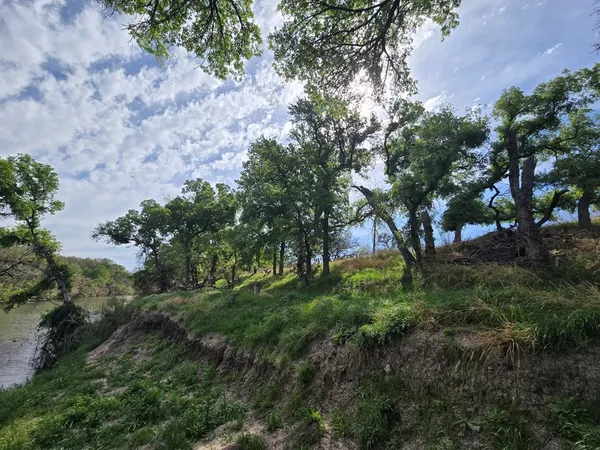 a view of a lake with houses in the back