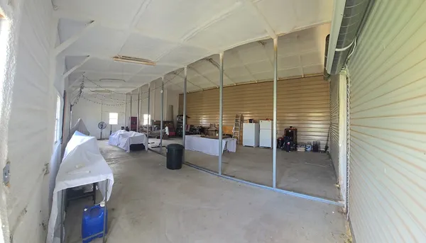 a view of a swimming pool with a yard