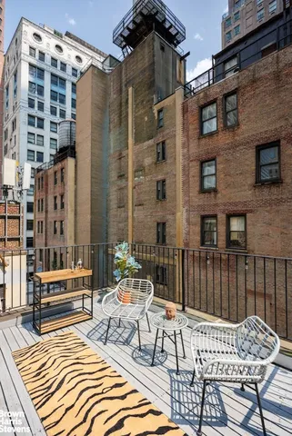 a view of a patio with a table and chairs