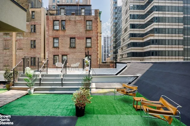 a view of a building with a yard