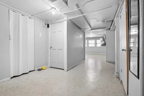 a bathroom with a toilet a sink and a mirror