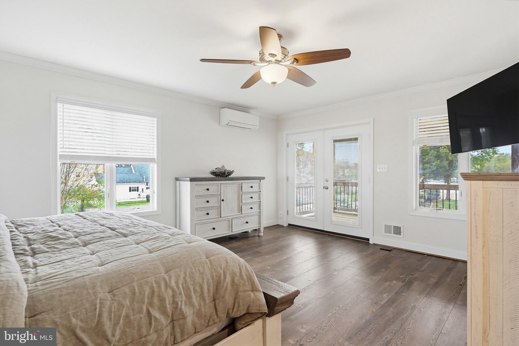 2006 Poplar Ridge Road Pasadena, MD 21122 - Photo 53 of 69 a spacious bedroom with a bed and a flat screen tv