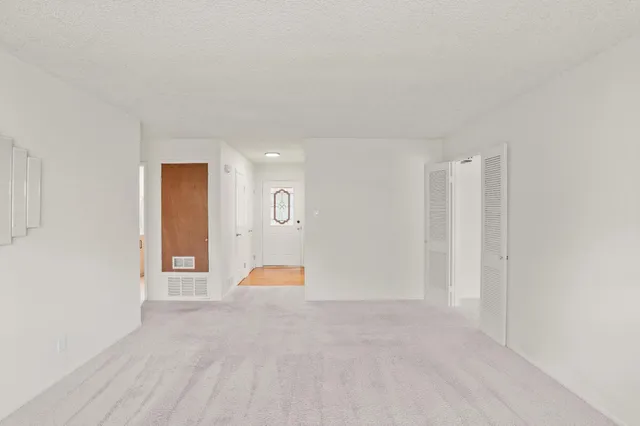 a bathroom with a toilet sink vanity and mirror