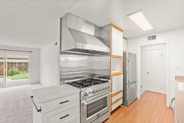 a bedroom with a bed and a sink