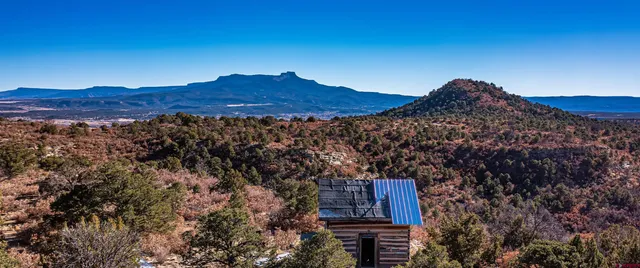 a view of a house with a mountain
