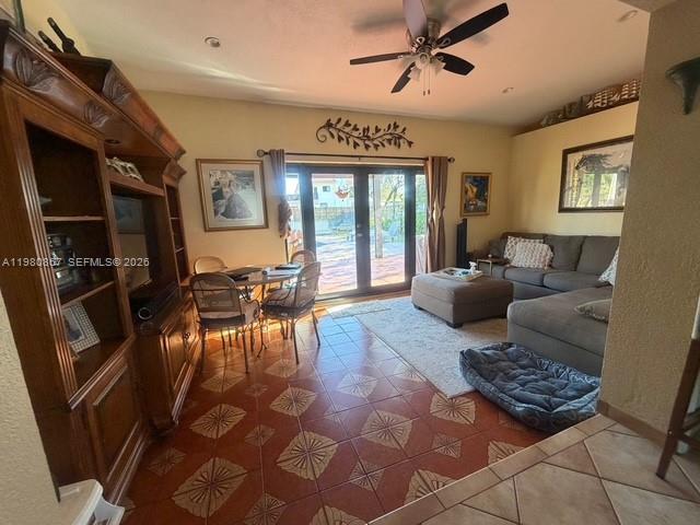 10720 Southwest 43rd Lane Miami, FL 33165 - Photo 11 of 16 a living room with furniture and a floor to ceiling window