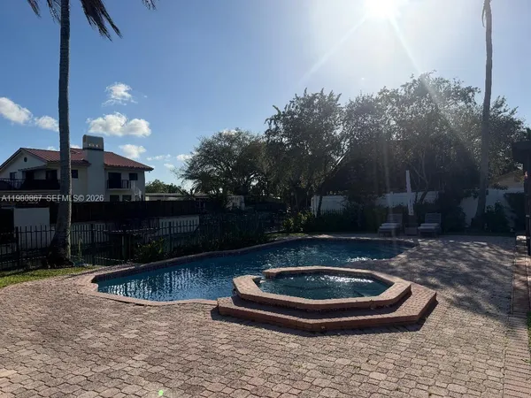 a view of residential houses with outdoor space and lake view