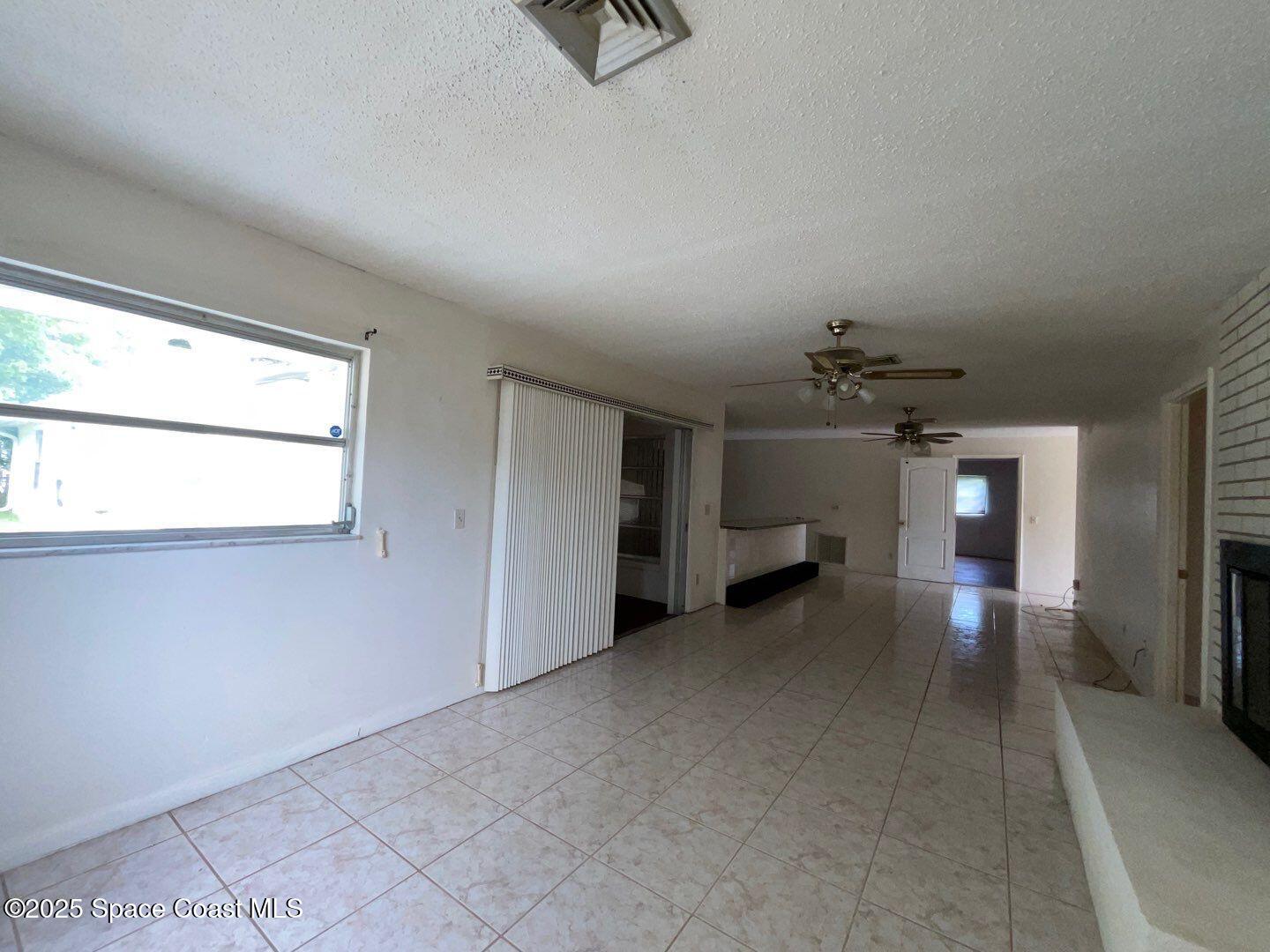 617 Walker Street Melbourne, FL 32901 - Photo 13 of 38 a view of a livingroom with a staircase
