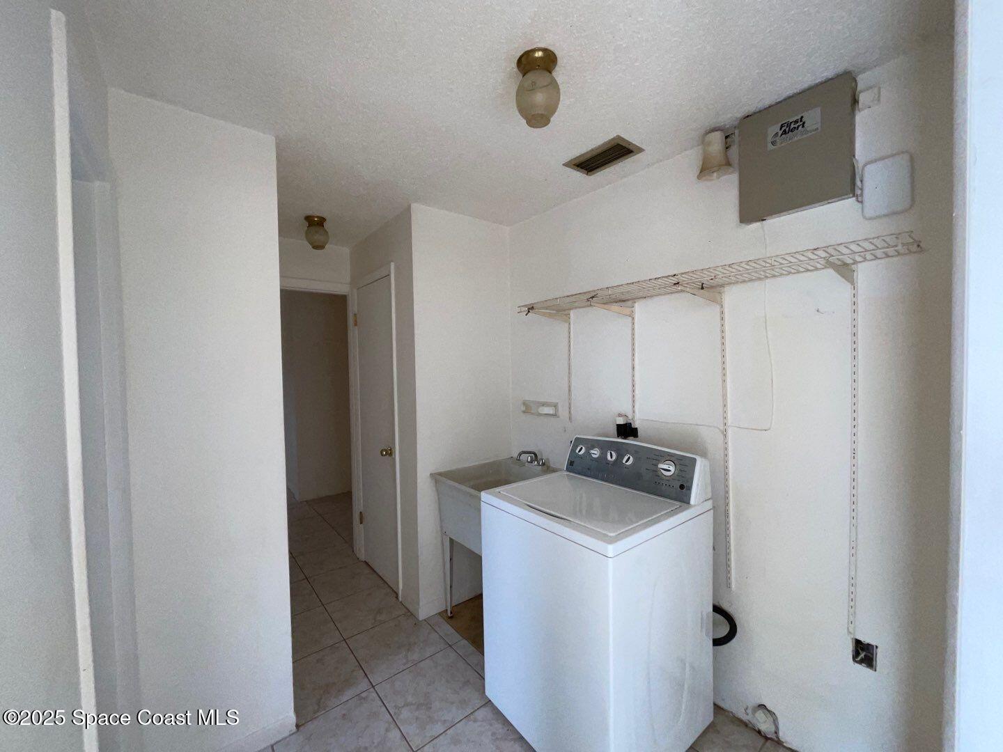 617 Walker Street Melbourne, FL 32901 - Photo 16 of 38 a room with storage and utility