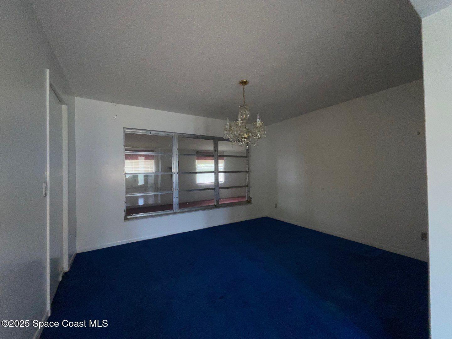 617 Walker Street Melbourne, FL 32901 - Photo 18 of 38 an empty room with windows and fireplace