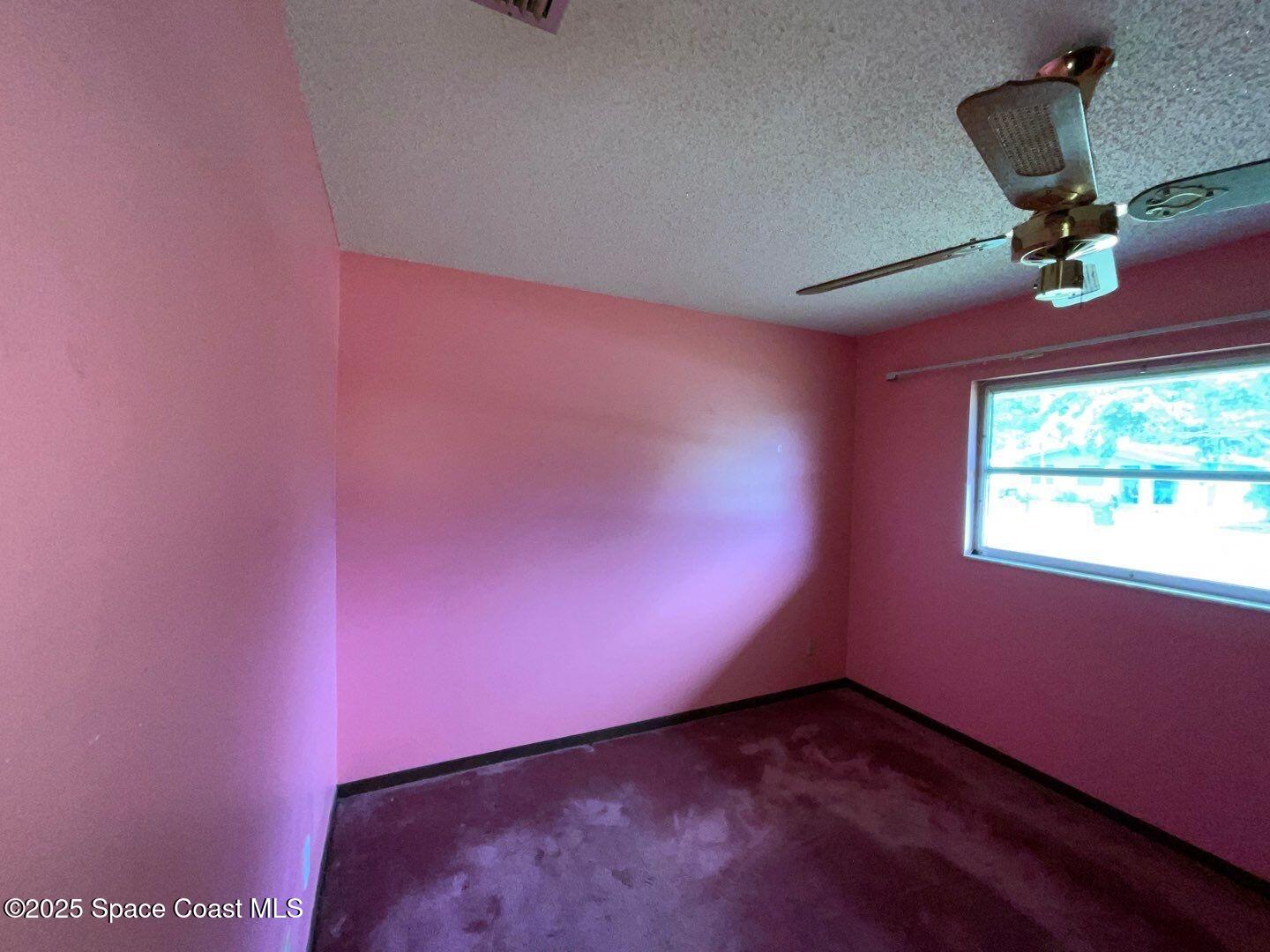 617 Walker Street Melbourne, FL 32901 - Photo 23 of 38 an empty room with a window