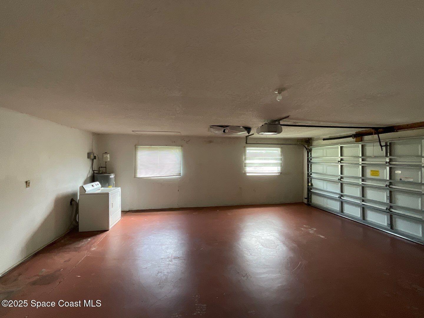 617 Walker Street Melbourne, FL 32901 - Photo 38 of 38 a view of an empty room with a window and wooden floor