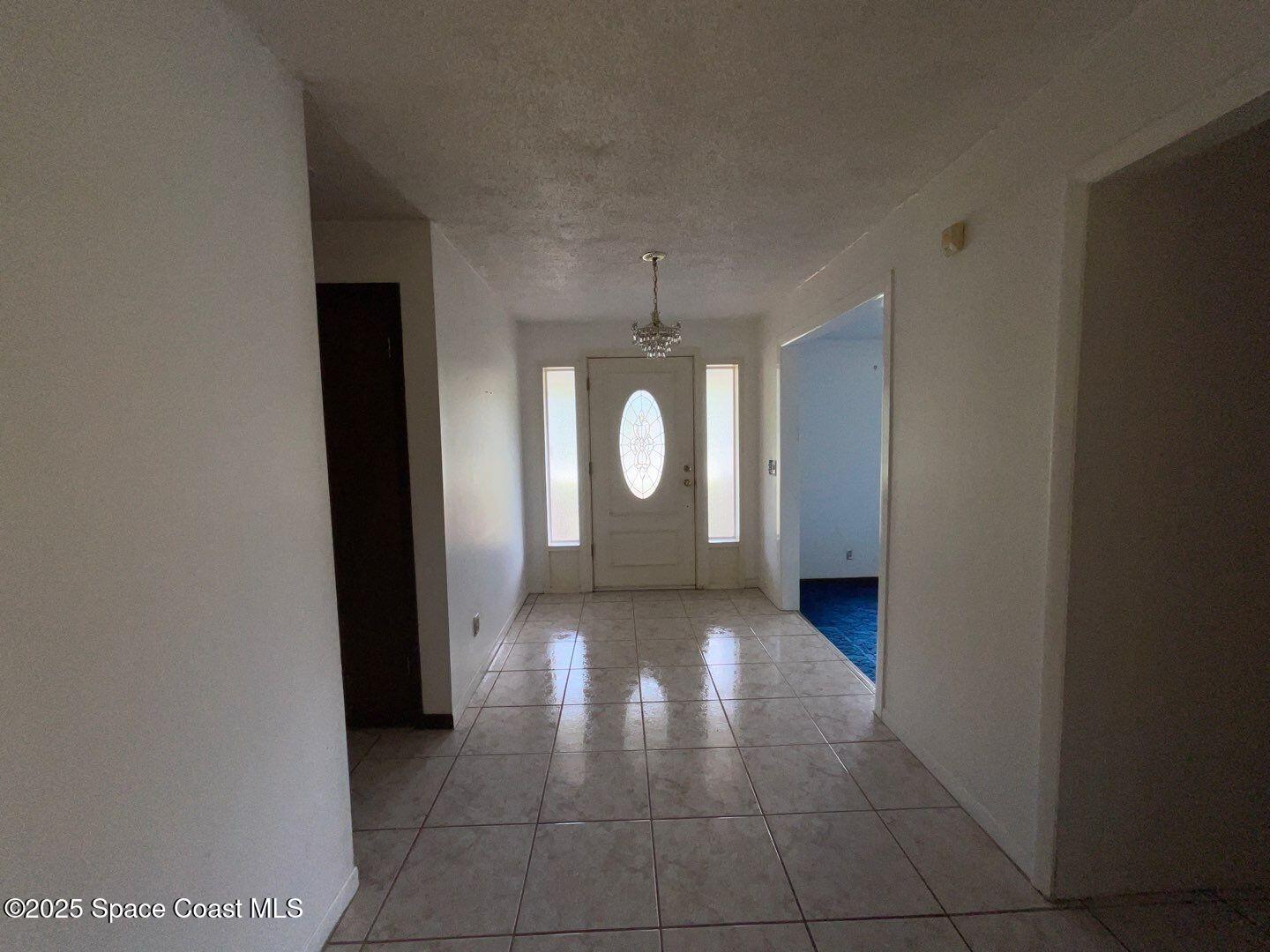 617 Walker Street Melbourne, FL 32901 - Photo 6 of 38 a view of a bathroom with a sink and a mirror