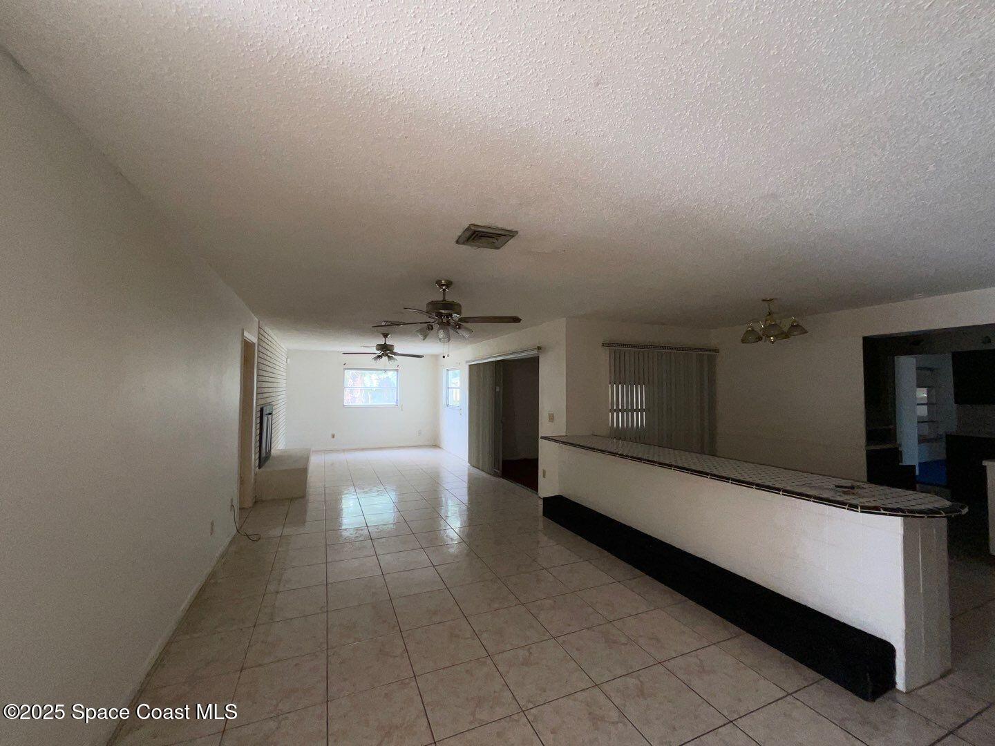 617 Walker Street Melbourne, FL 32901 - Photo 7 of 38 a hallway with a large window