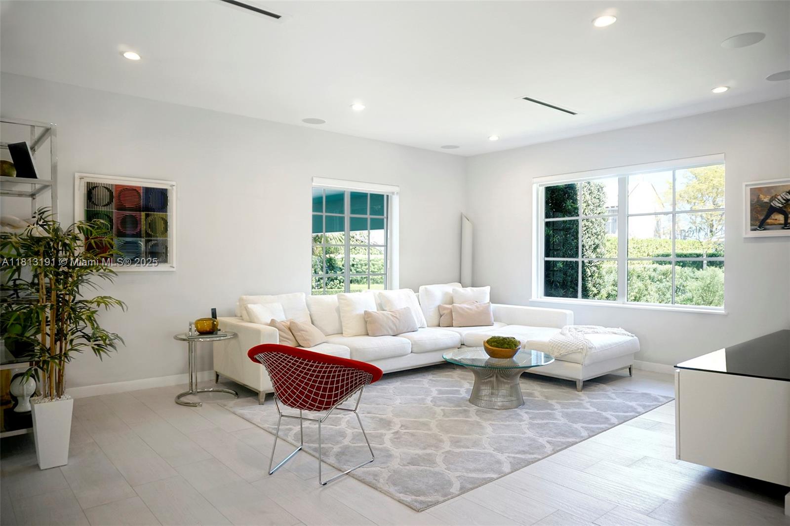 4380 Lake Road Miami, FL 33137 - Photo 11 of 41 a living room with furniture and large windows