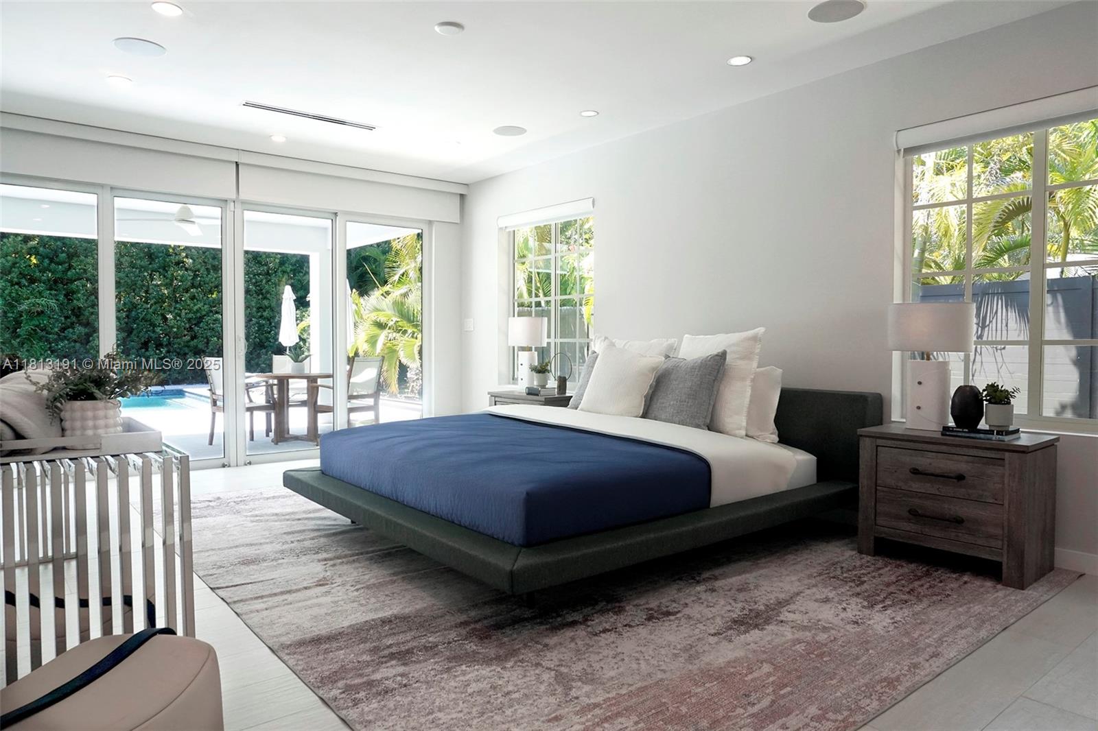 4380 Lake Road Miami, FL 33137 - Photo 13 of 41 a spacious bedroom with a bed and large windows